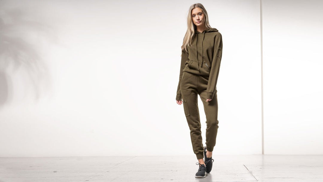 Girl in army green bamboo fleece sweater and joggers 