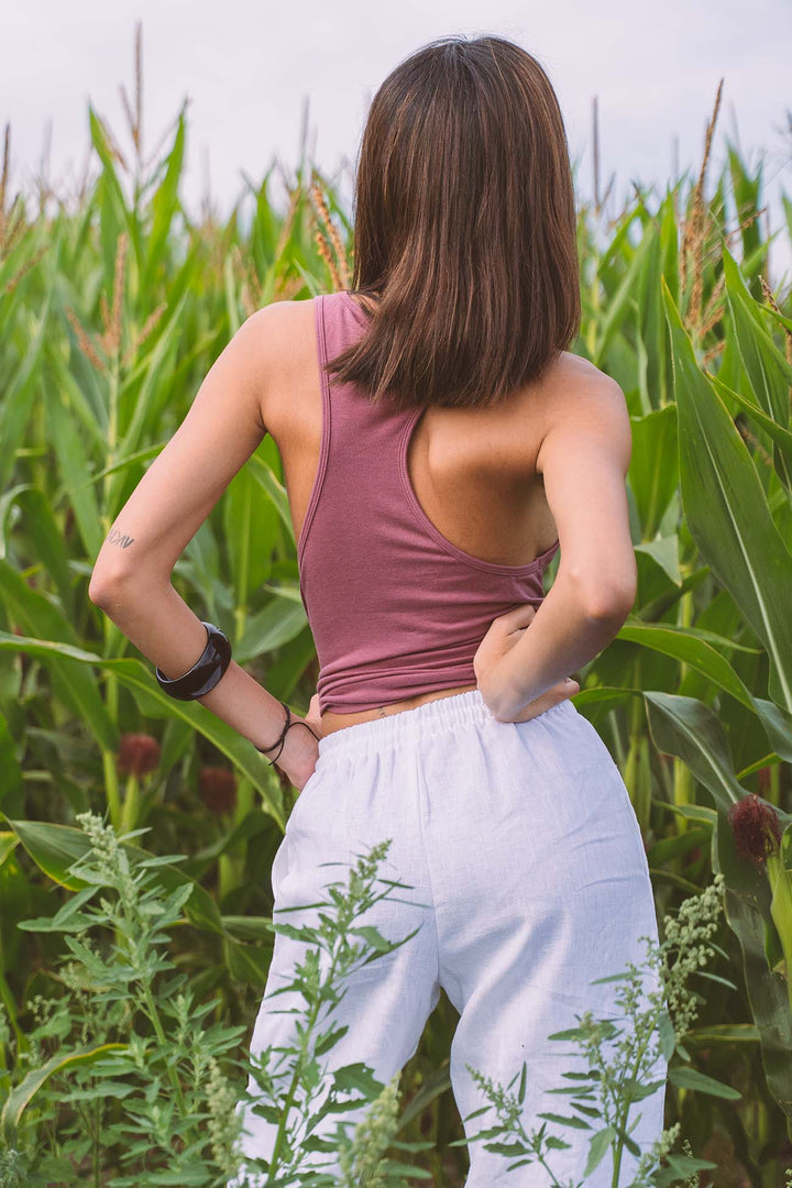 Close-up of the racer back on the Organic Aria organic cotton tank top with side boob cleavage