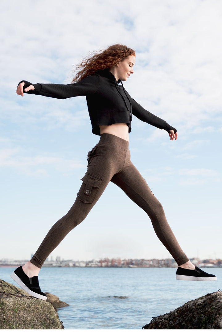 Tiffany in a black eco crop hoodie and cocoa brown bamboo cargo leggings with two back pockets and two side pockets